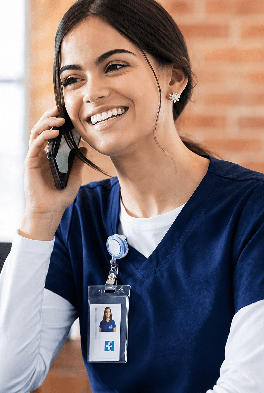 Smiling nurse talking on the phone.